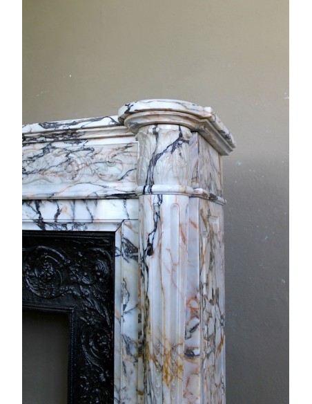Exceptional antique Neoclassical-style fireplace mantel with fine floral carvings in stunning Italian Calacatta Gold marble.