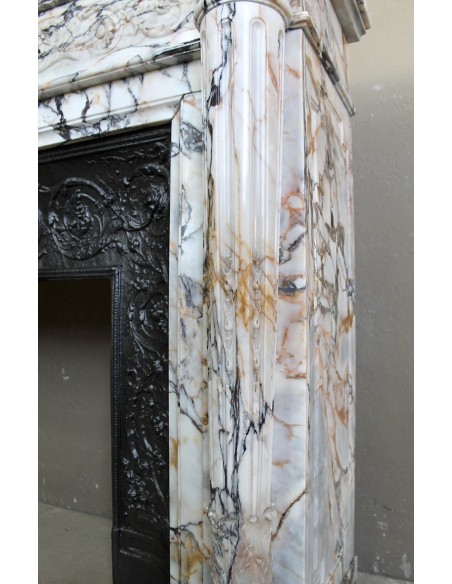 Exceptional antique Neoclassical-style fireplace mantel with fine floral carvings in stunning Italian Calacatta Gold marble.