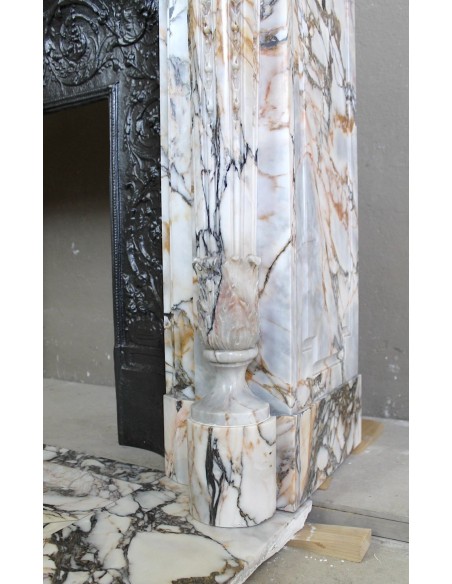 Exceptional antique Neoclassical-style fireplace mantel with fine floral carvings in stunning Italian Calacatta Gold marble.