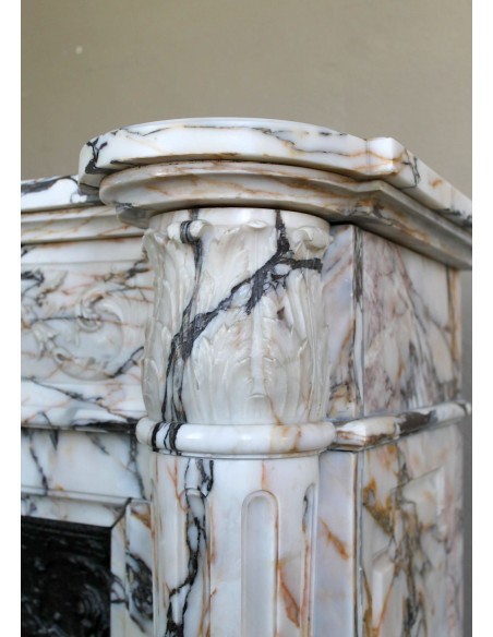 Exceptional antique Neoclassical-style fireplace mantel with fine floral carvings in stunning Italian Calacatta Gold marble.