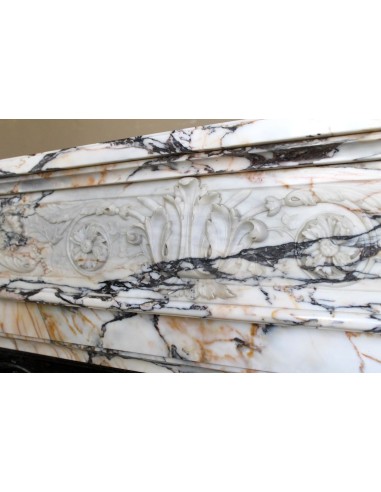 Exceptional antique Neoclassical-style fireplace mantel with fine floral carvings in stunning Italian Calacatta Gold marble.