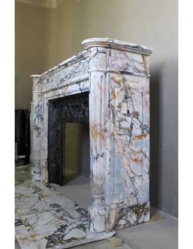 Exceptional antique Neoclassical-style fireplace mantel with fine floral carvings in stunning Italian Calacatta Gold marble.