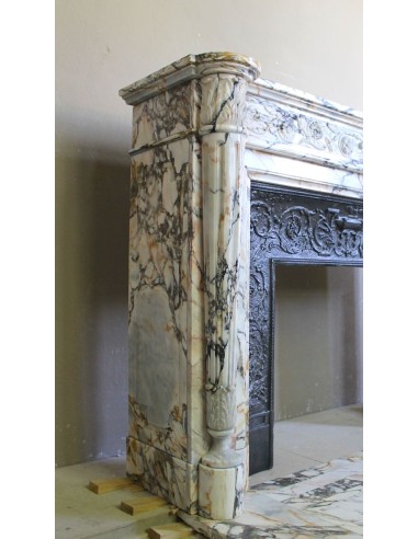 Exceptional antique Neoclassical-style fireplace mantel with fine floral carvings in stunning Italian Calacatta Gold marble.