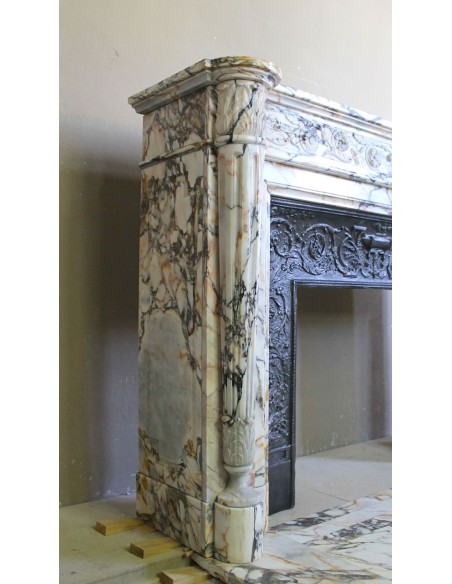 Exceptional antique Neoclassical-style fireplace mantel with fine floral carvings in stunning Italian Calacatta Gold marble.