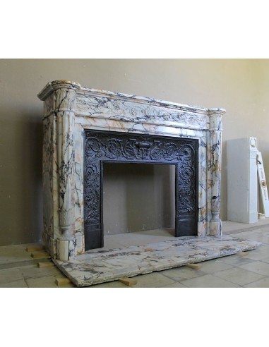 Exceptional antique Neoclassical-style fireplace mantel with fine floral carvings in stunning Italian Calacatta Gold marble.