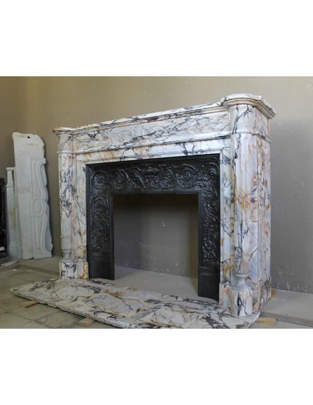 Exceptional antique Neoclassical-style fireplace mantel with fine floral carvings in stunning Italian Calacatta Gold marble.