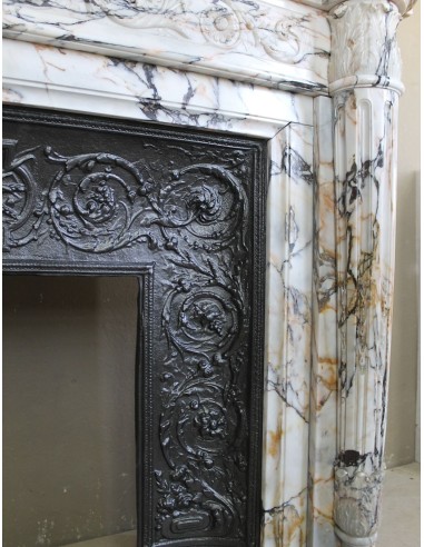 Exceptional antique Neoclassical-style fireplace mantel with fine floral carvings in stunning Italian Calacatta Gold marble.