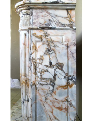 Exceptional antique Neoclassical-style fireplace mantel with fine floral carvings in stunning Italian Calacatta Gold marble.