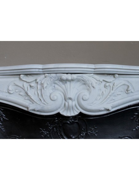 Antique Louis XV "Rosaces" fireplace mantel carved in top-quality White Carrara marble, extremely pure and refined.