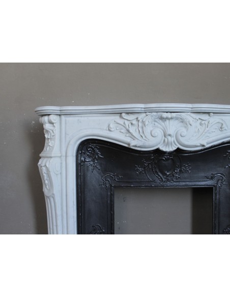 Antique Louis XV "Rosaces" fireplace mantel carved in top-quality White Carrara marble, extremely pure and refined.