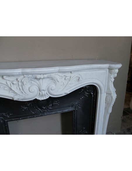 Antique Louis XV "Rosaces" fireplace mantel carved in top-quality White Carrara marble, extremely pure and refined.