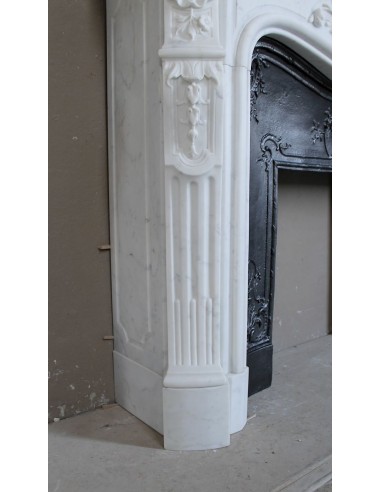 Antique Louis XV "Rosaces" fireplace mantel carved in top-quality White Carrara marble, extremely pure and refined.