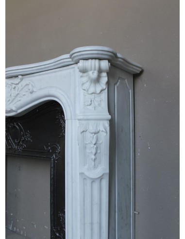 Antique Louis XV "Rosaces" fireplace mantel carved in top-quality White Carrara marble, extremely pure and refined.