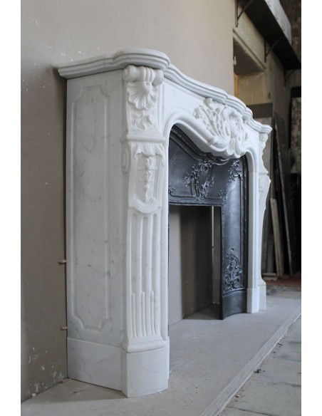 Antique Louis XV "Rosaces" fireplace mantel carved in top-quality White Carrara marble, extremely pure and refined.