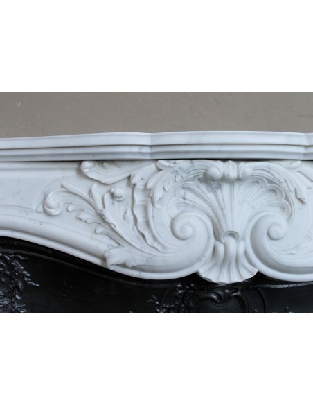 Antique Louis XV "Rosaces" fireplace mantel carved in top-quality White Carrara marble, extremely pure and refined.