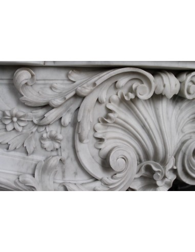 Antique Baroque white marble fire surround with exquisitely refined floral carvings, with its original cast iron insert.