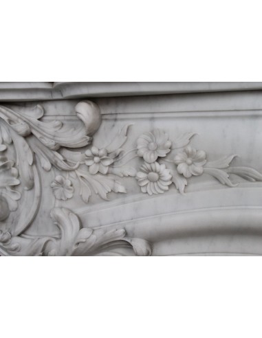 Antique Baroque white marble fire surround with exquisitely refined floral carvings, with its original cast iron insert.