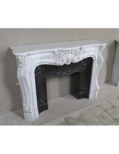 Antique Baroque white marble fire surround with exquisitely refined floral carvings, with its cast iron insert.