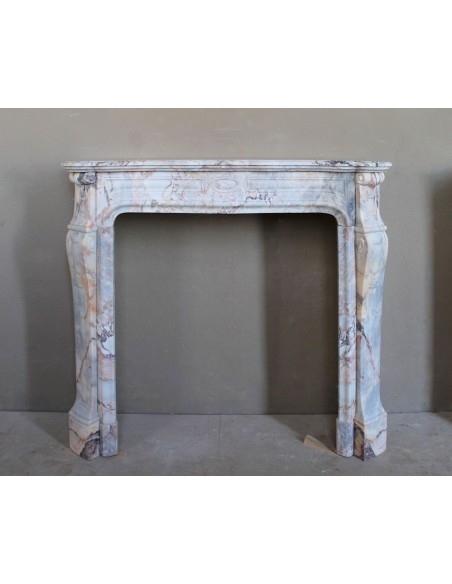 Antique Baroque style fireplace mantel in  beautiful Calacatta Gold marble. This is a rare and elegant marble fire surround.