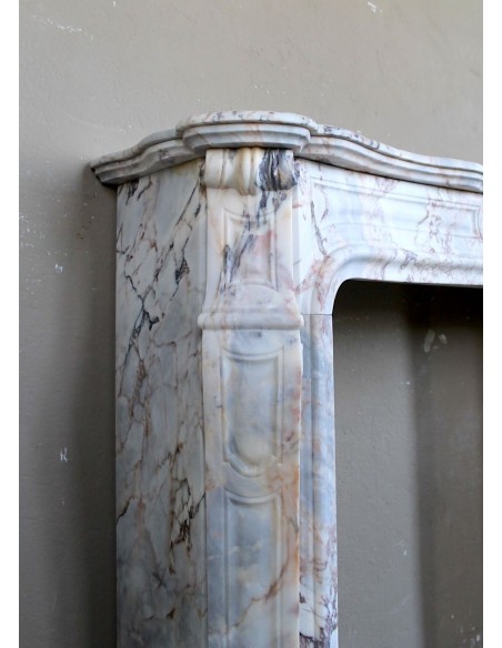 Antique Baroque style fireplace mantel in  beautiful Calacatta Gold marble. This is a rare and elegant marble fire surround.