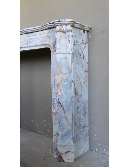 Antique Baroque style fireplace mantel in  beautiful Calacatta Gold marble. This is a rare and elegant marble fire surround.