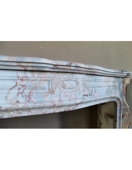 Antique Baroque style fireplace mantel in  beautiful Calacatta Gold marble. This is a rare and elegant marble fire surround.
