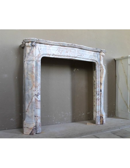 Antique Baroque style fireplace mantel in  beautiful Calacatta Gold marble. This is a rare and elegant marble fire surround.