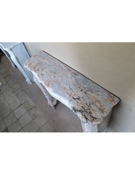 Antique Baroque style fireplace mantel in  beautiful Calacatta Gold marble. This is a rare and elegant marble fire surround.