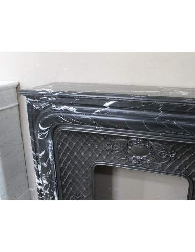 Antique "Boudin Arrondi" fireplace mantel in Black Marquinia veined marble provided with its original cast iron insert.