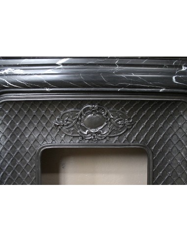 Antique "Boudin Arrondi" fireplace mantel in Black Marquinia veined marble provided with its original cast iron insert.