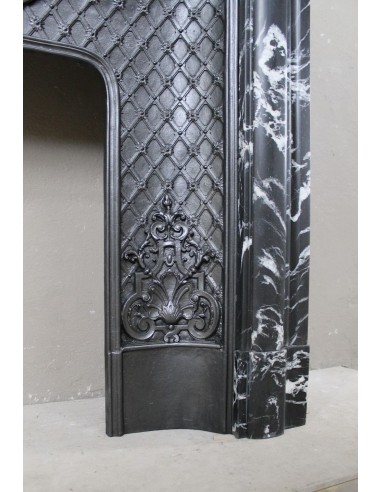 Antique "Boudin Arrondi" fireplace mantel in Black Marquinia veined marble provided with its original cast iron insert.
