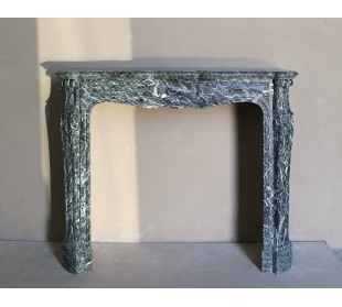Antique Baroque-style fire surround in green Verde Alpi marble, dating back to the 19th century. This is a truly antique mantel.