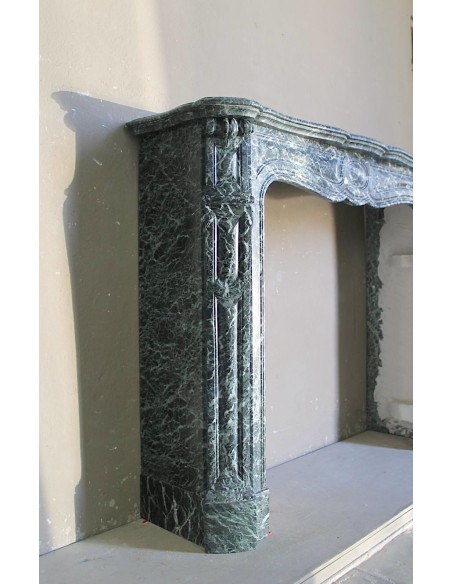 Antique Baroque-style fire surround in green Verde Alpi marble, dating back to the 19th century. This is a truly antique mantel.