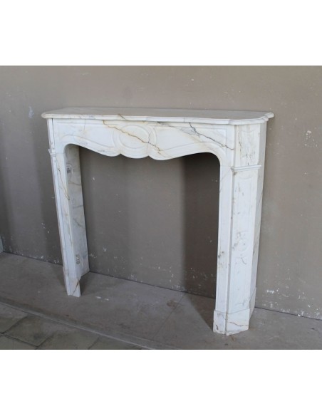 Antique Louis XV "Pompadour Plat" fireplace mantel in rare Paonazzo marble, a gorgeous white marble with golden veins.