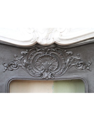Louis XV “Moustache” fireplace mantel in White Carrara marble and fitted with its original cast iron insert.