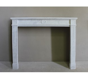 Neoclassical “Cannelure” fire surround in white Carrara marble, with very original, purely neoclassical lines.