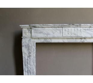 Antique neoclassical fireplace mantel carved in White veined Arabescato marble. This marble surround has exquisite veining. 2