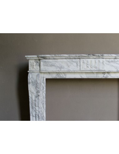 Antique neoclassical fireplace mantel carved in White veined Arabescato marble. This marble surround has exquisite veining.