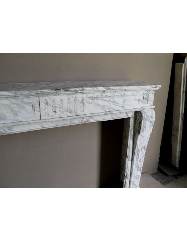 Antique neoclassical fireplace mantel carved in White veined Arabescato marble. This marble surround has exquisite veining.