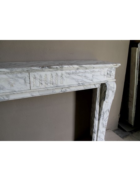 Antique neoclassical fireplace mantel carved in White veined Arabescato marble. This marble surround has exquisite veining.