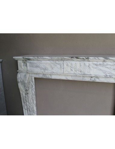 Antique neoclassical fireplace mantel carved in White veined Arabescato marble. This marble surround has exquisite veining.