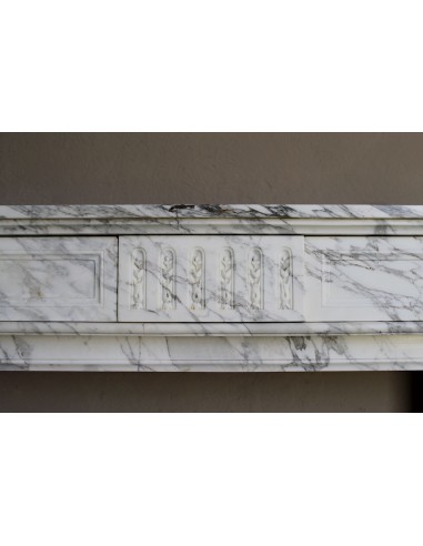 Antique neoclassical fireplace mantel carved in White veined Arabescato marble. This marble surround has exquisite veining.