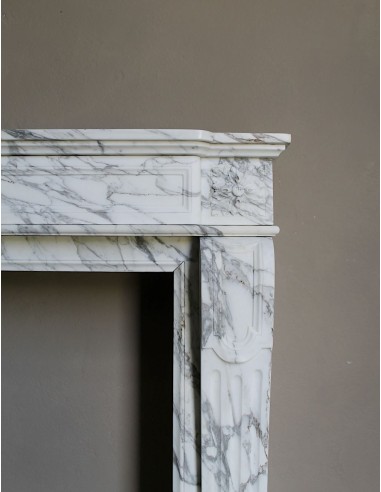 Antique neoclassical fireplace mantel carved in White veined Arabescato marble. This marble surround has exquisite veining.