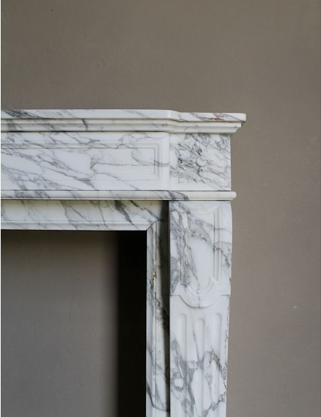 Antique neoclassical fireplace mantel carved in White veined Arabescato marble. This marble surround has exquisite veining.