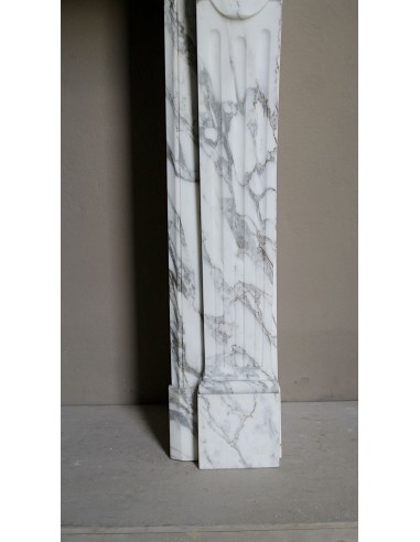 Antique neoclassical fireplace mantel carved in White veined Arabescato marble. This marble surround has exquisite veining.