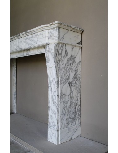 Antique neoclassical fireplace mantel carved in White veined Arabescato marble. This marble surround has exquisite veining.