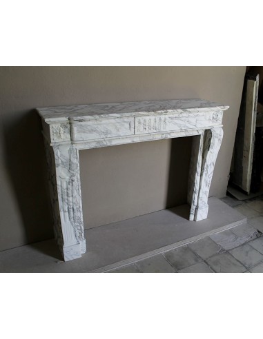 Antique neoclassical fireplace mantel carved in White veined Arabescato marble. This marble surround has exquisite veining.