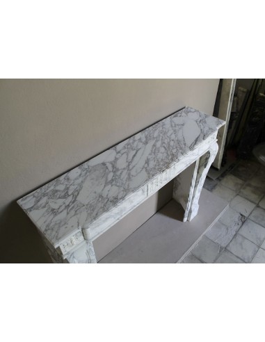 Antique neoclassical fireplace mantel carved in White veined Arabescato marble. This marble surround has exquisite veining.