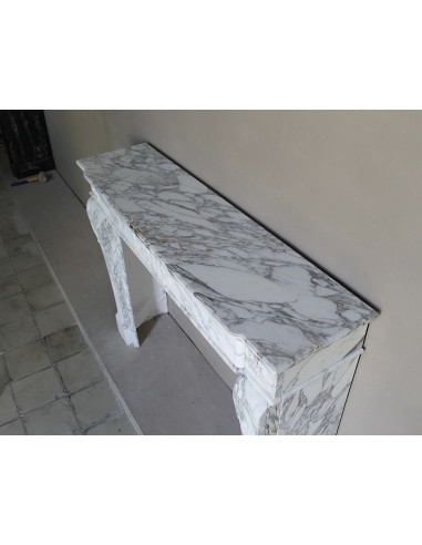 Antique neoclassical fireplace mantel carved in White veined Arabescato marble. This marble surround has exquisite veining.