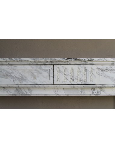 Antique neoclassical fireplace mantel carved in White veined Arabescato marble. This marble surround has exquisite veining.
